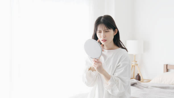 istock A woman concerned about rough skin 2154708690