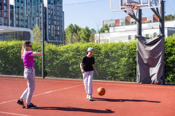 istock mother and daughter play basketball 2154711268
