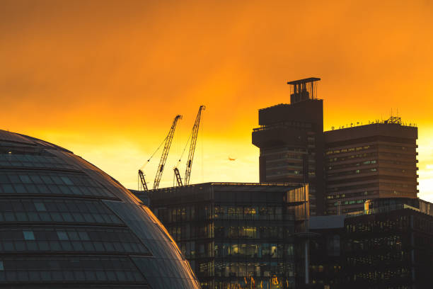 Illuminated office buildings in London at sunset
