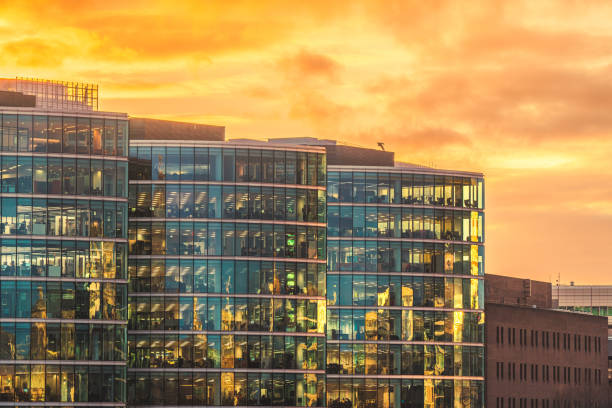 istock Illuminated office buildings in London at sunset 2154711428