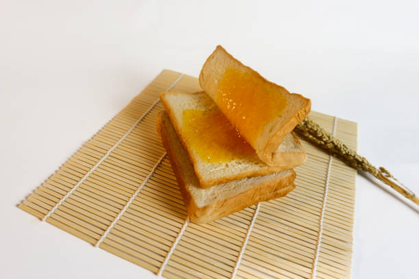 studio photography of bread and wheat on an isolated white background