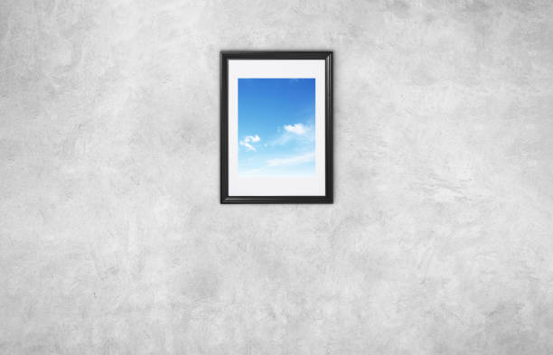 istock Frame with blue sky on a gray wall. Freedom concept 2154716171