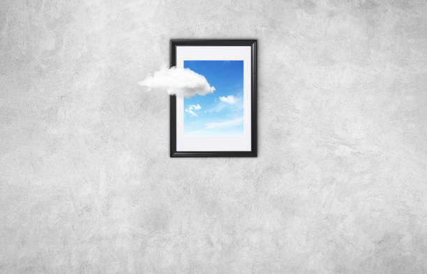 istock Creative frame with cloud and blue sky on a gray wall. Think outside the box surreal minimal concept 2154716181