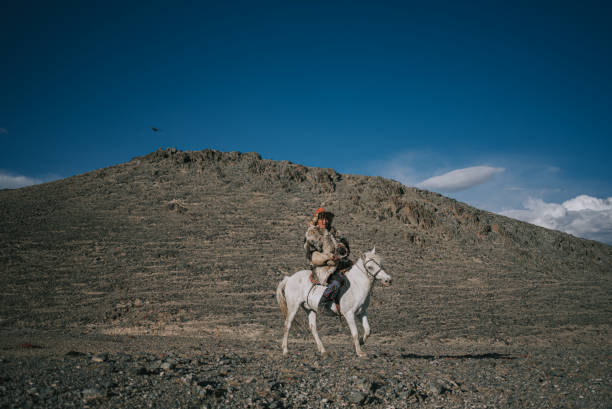Kek-Say, Kyrgyzstan - August 9, 2025. Outdoor scene showing a Golden Eagle hunting demonstration in the mountains of Kyrgyzstan.