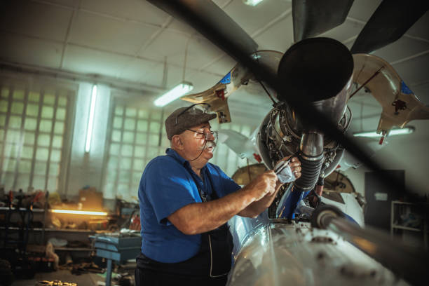 istock Senior mechanic working on helicopter in hangar 2154718001