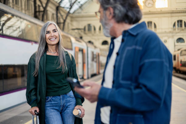 istock Happy senior couple waiting for their train and going on a journey 2154718759