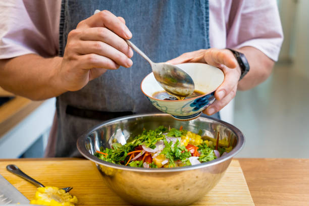 istock Chef at the kitchen preparing spicy glass noodle salad 2154722346