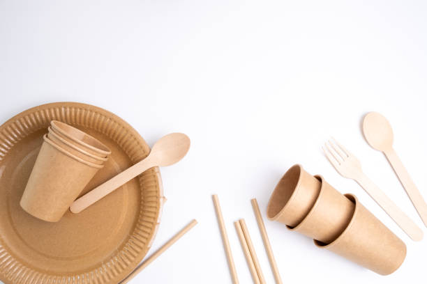 istock Kraft paper tableware: cups, food boxes, isolated on a light background. A set of various disposable tableware. Recycling and zero waste concept. Mock up 2154722391