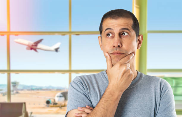 istock doubtful man at the airport 2154722570