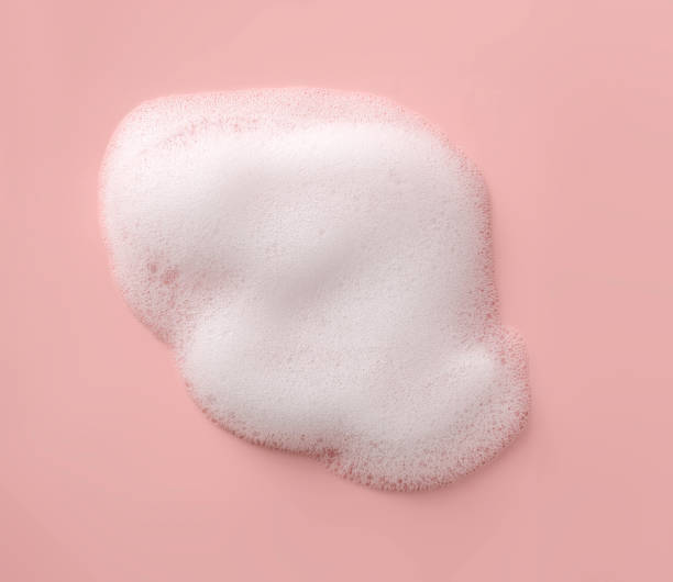 istock White cosmetic mousse smudge on a pink background 2154723011
