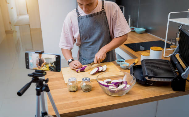 istock The chef is broadcasting live from workshop how to prepare a grilled eggplants with garlic 2154723912