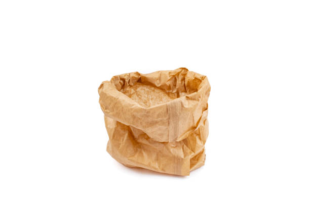 istock Folded and wrinkled paper bag isolated on white background, abstract backdrop 2154724354