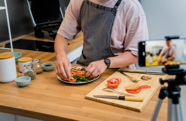 istock The chef is broadcasting live from workshop how to prepare a grilled eggplants with garlic 2154724759