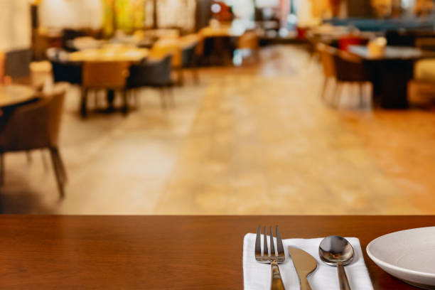 istock Restaurant interior with silverware on table. Service industry jobs, employment, and dining concept. 2154727725