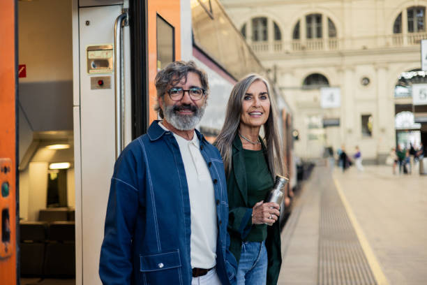 istock Happy senior couple waiting for a train 2154730097