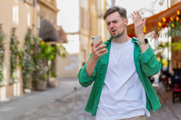 istock Sad man using smartphone browsing loses lottery casino application results bad news fail virus 2154730826