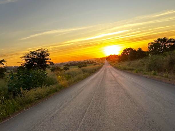 istock beautifull sunset  image on ranch scene. Road on de the ranch 2154731333