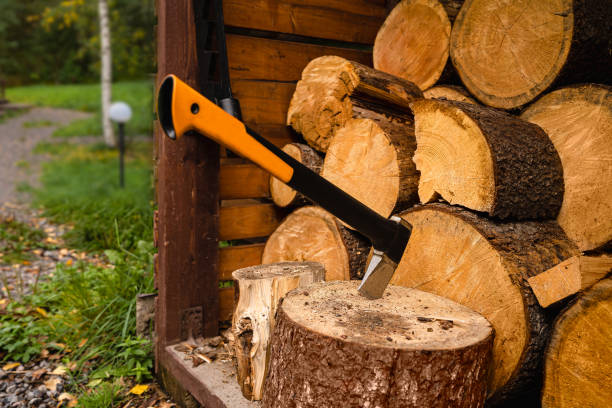 istock a new axe stuck in a wooden deck. 2154732366