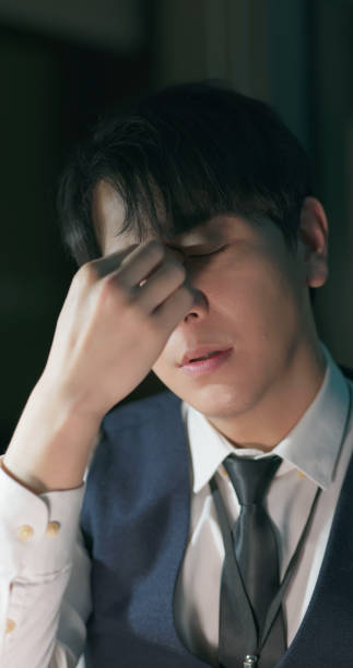 istock young businessman has tired eye 2154733764