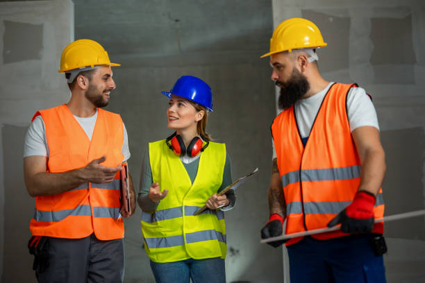 istock Construction team planning a building blueprint project on site with collaboration for architect innovation. Architecture, design and engineers with teamwork for successful 2154735261