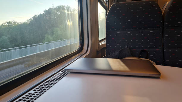 istock Working on the Go: Using a Laptop on a Train Journey with Scenic Views Outside the Window - Emphasizing Productive Travel and Efficient Transportation 2154739769