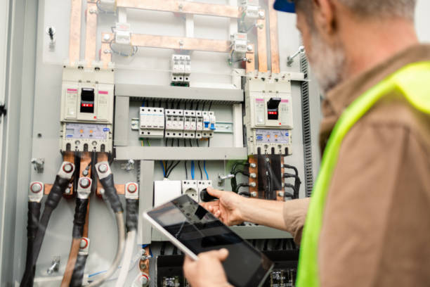 Mature engineer repairing a solar energy generator