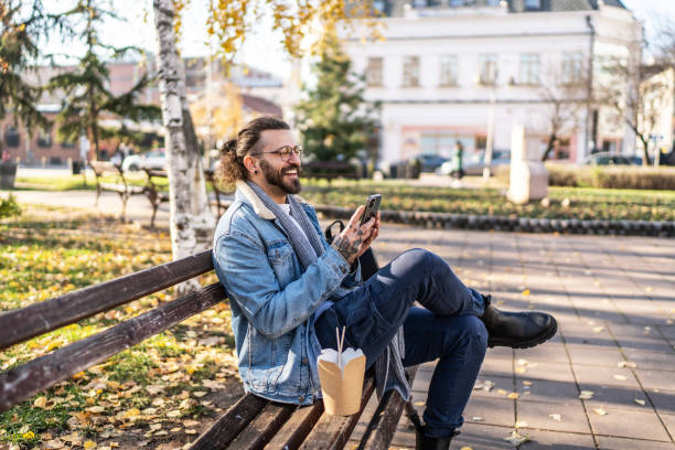 istock Young man using cell phone and enjoying in the city 2154742888