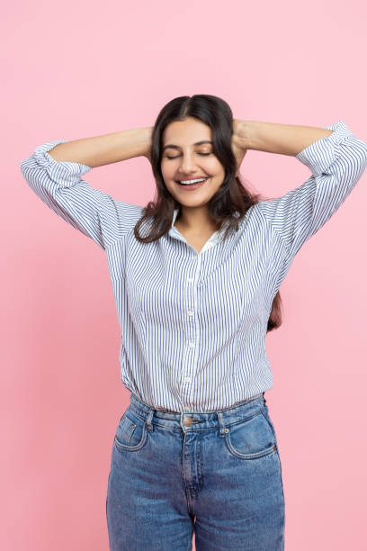 istock Overjoyed Indian woman keeps hands on head expressing positive emotions 2154743400