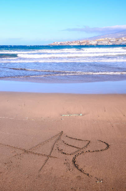 istock A beach with a tree and the number 1 written in the sand 2154743784