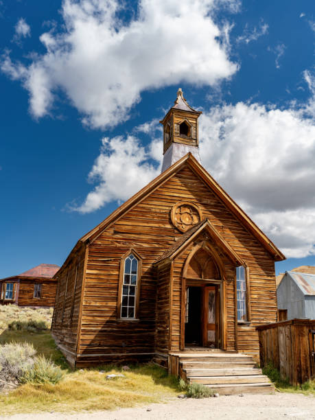 Weathered old church with blue sky and clouds