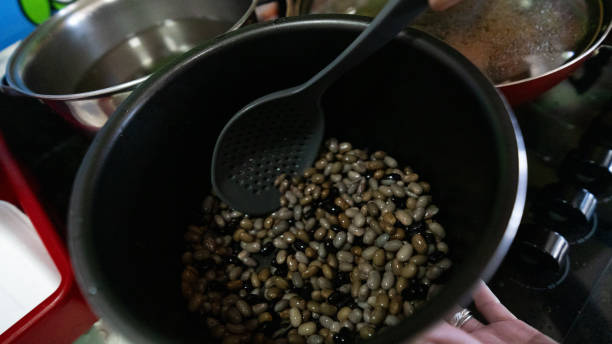 istock Beans of various colors and sizes being prepared 2154750987