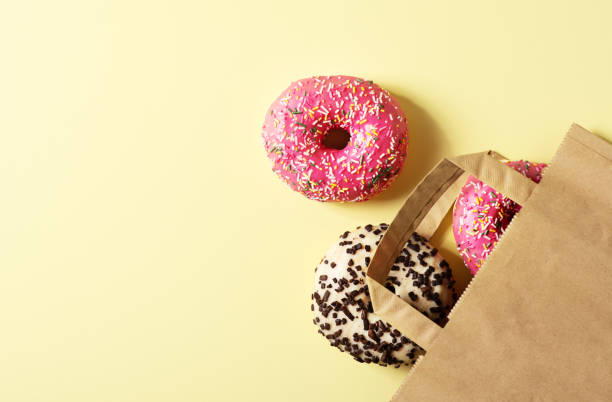 istock Pink and chocolate donuts in craft package 2154755479