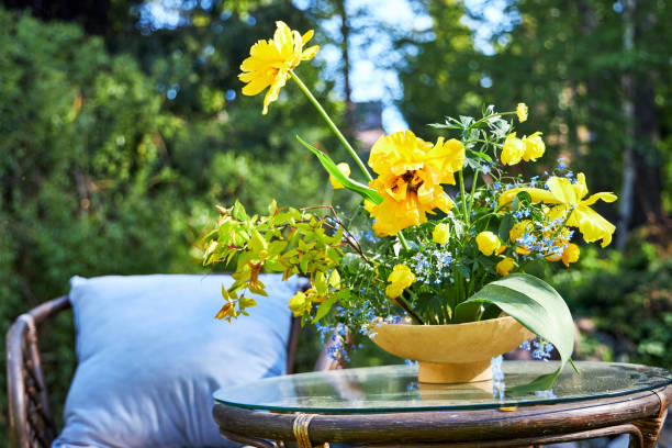 Floral composition in a vase on the summer veranda