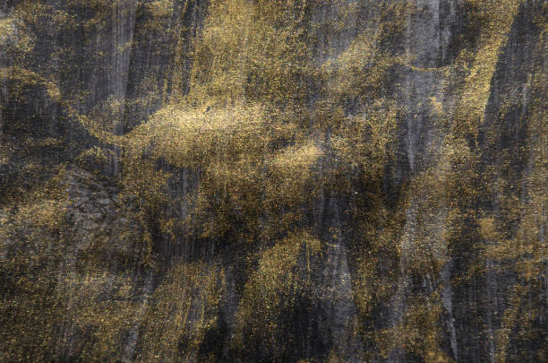 istock art background black with gold streaks 2154761733