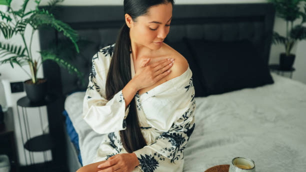istock Woman at home using shea butter body cream 2154762356