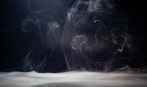 istock Abstract smoke on a dark background . Isolated . 2154762757