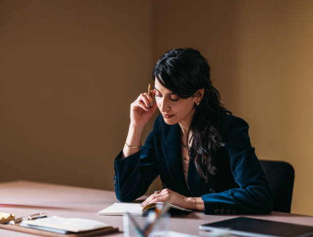 istock Professional Woman Focused on Work in Office Setting 2154762869
