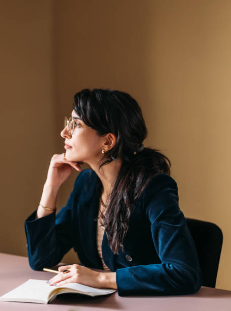 istock Thoughtful Professional Woman Brainstorming in Office 2154762897