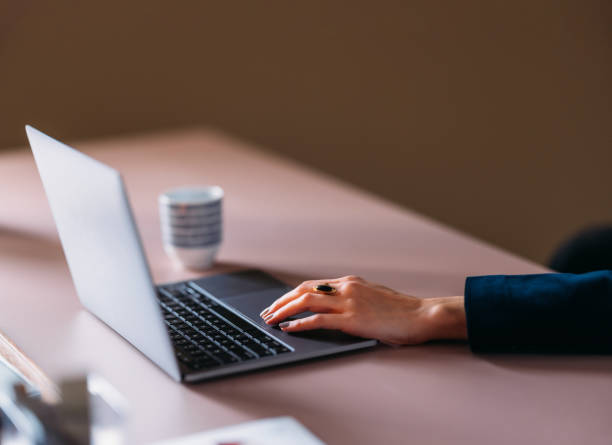istock Professional Woman Typing on Laptop at Modern Workspace 2154762939