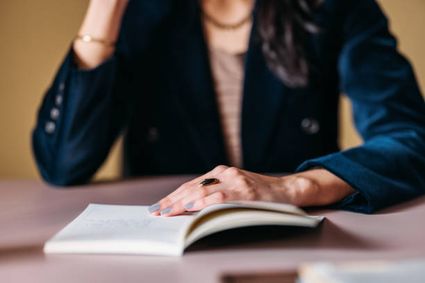 istock Professional Woman Reviewing Documents at Office Desk 2154762987