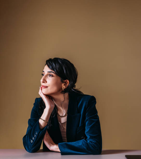 istock Businesswoman in Deep Thought at Table 2154763003