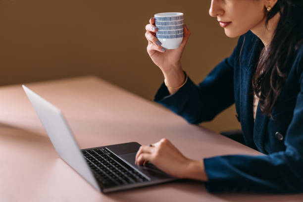 istock Professional Woman Working and Drinking Coffee in Office 2154763081