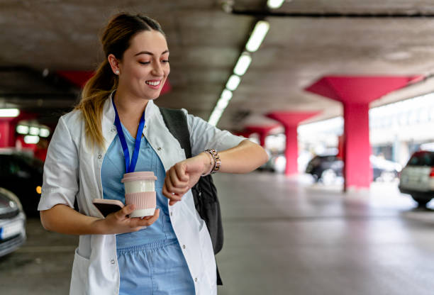 istock Nurse checks time in garage setting 2154764822