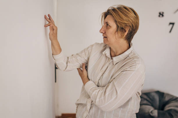 istock Old woman doing light recovery exercises at home 2154770267