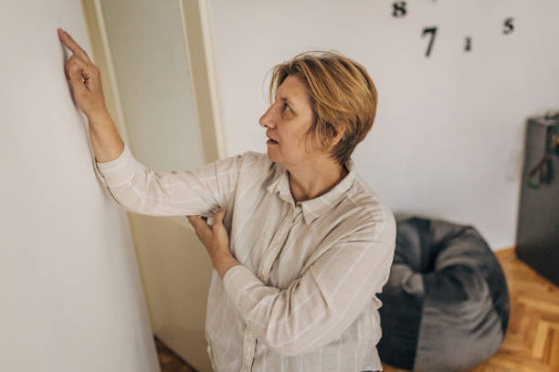 istock Old woman doing light recovery exercises at home 2154770326