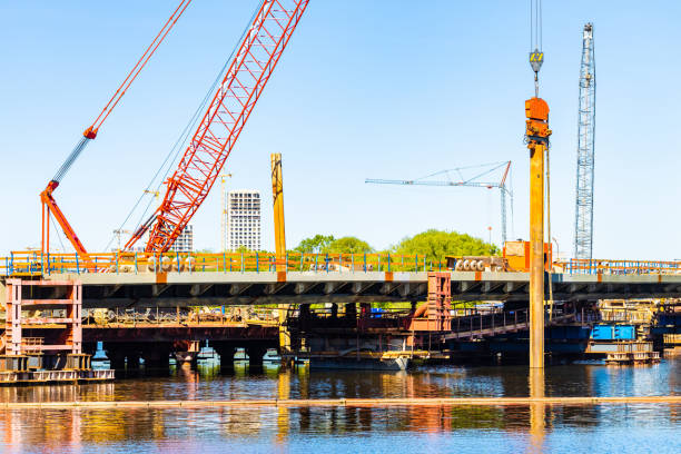 istock Moscow, Russia - May 22, 2024: floating crane building a bridge 2154770937