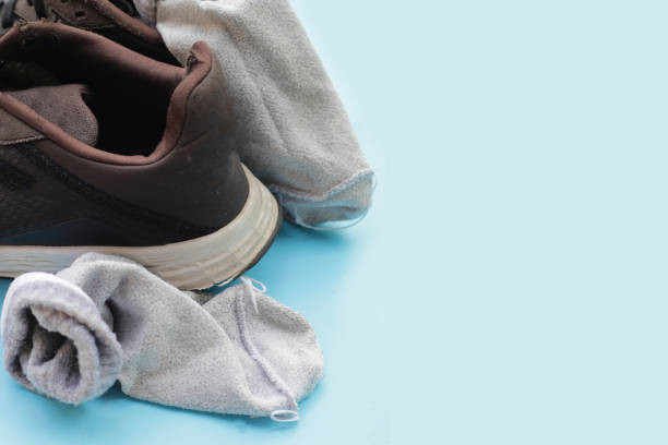 istock Black sneakers with dirty socks 2154771794