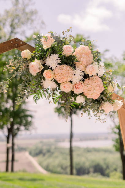 istock A beautiful wedding arch decorated with pink flowers during a wedding ceremony 2154772910