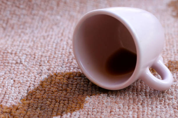 istock Coffee spilled from white cup on the carpet 2154774820