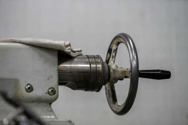 Old lathe machine on the background close-up image